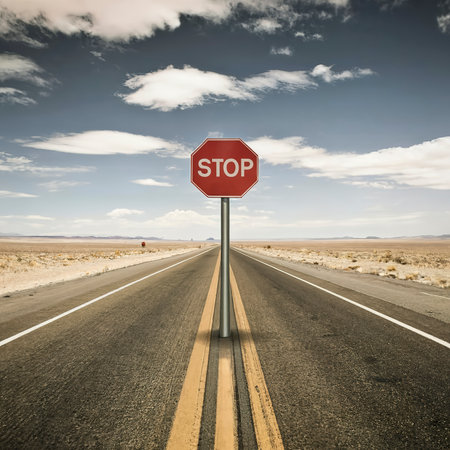Concept of a stop sign in the middle of nowhere. Signifies the pace of modern life.の素材