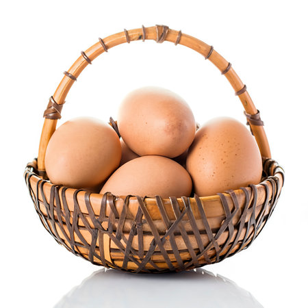 Eggs in basket isolated on white backgroundの素材