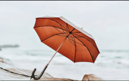 Beautiful open umbrella on white backgroundの素材