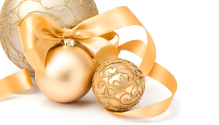 golden christmas decoration balls with satin ribbon, isolated on white backgroundの素材