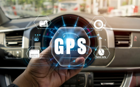 GPS, Global Positioning System, Person hand using smart phone on car with Global Positioning System icon on virtual screen.の素材