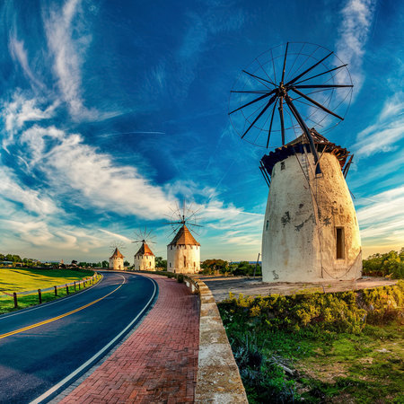Passing windmills on a road tripの素材