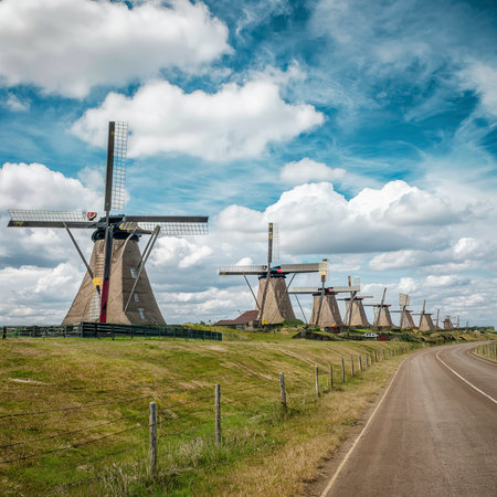 Passing windmills on a road tripの素材