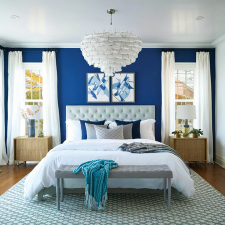 Stylish modern white and blue chandelier in trendy spacious bedroom with king size bedの素材