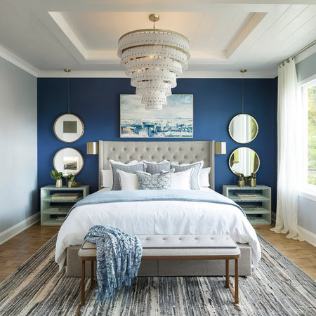 Stylish modern white and blue chandelier in trendy spacious bedroom with king size bedの素材