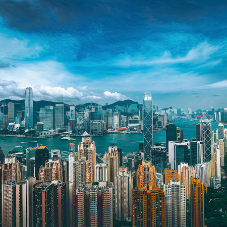 Beautiful architecture building exterior cityscape of hong kong city skyline with blue sky backgroundの素材