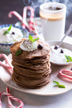 Chocolate mint christmas pancakes with coffee and candy canesの素材