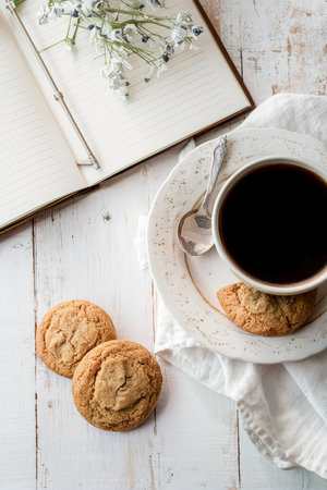 A cup of coffee with cookies. Breakfast tableの素材