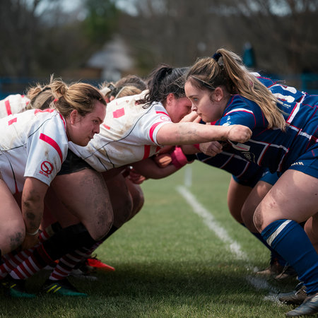 Close up of a female rugby players in a scrumの素材