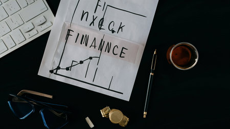 Concept of finance, documents and office supplies on black backgroundの素材