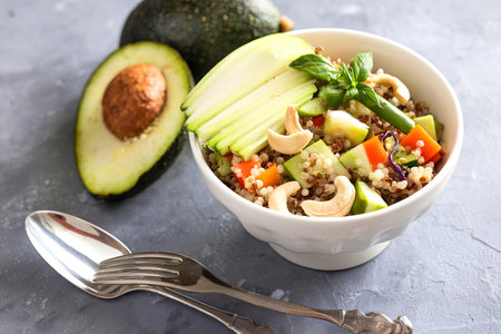 Warm curry vegetable quinoa salad with cashewの写真素材