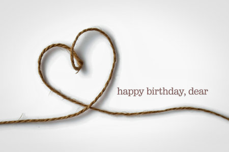 A simple and elegant image featuring a heart shape meticulously crafted from twine. The phrase...