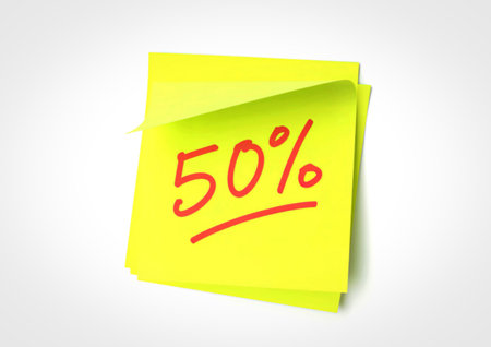 A close-up shot of a bright yellow sticky note with the number 50 and a percentage sign written in...