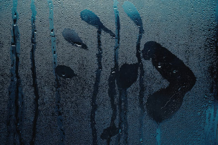 An abstract blue background with dark shapes and lines, creating a textured and visually appealing...