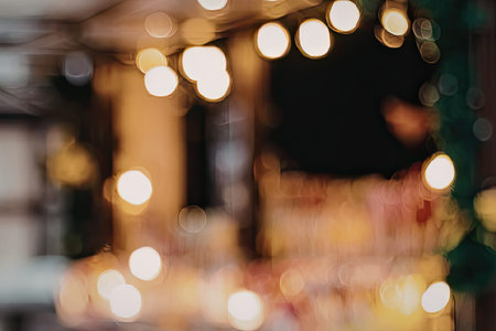 A blurry image of lights at night, possibly a cityscape or a festive setting.