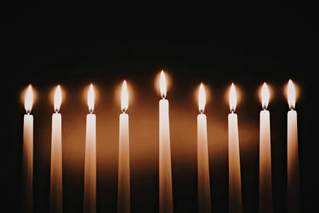 A serene and peaceful image of eight lit candles in a row against a dark background, creating a warm...