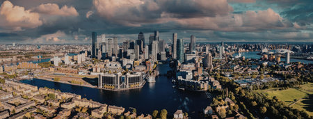 A panoramic view of London cityscape with River Thames flowing through it, showcasing modern...