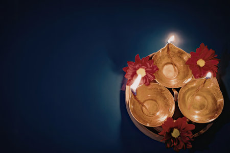 Diwali celebration with lit diyas and flowers