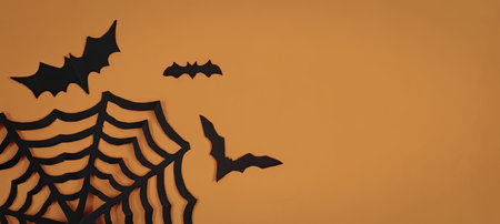 An orange background with a black spider web and bats silhouette