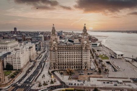 Aerial view of Liverpool cityscape at sunset, showcasing iconic buildings and waterfrontの写真素材