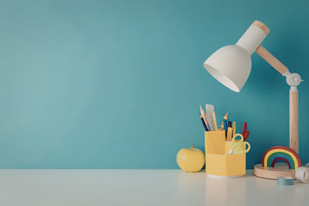 A well-lit desk with a lamp, colorful stationery, and a rainbow decoration on a blue background.