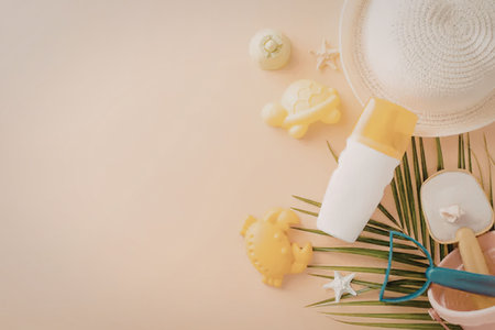A collection of summer beach essentials including sunscreen, a hat, and toys.