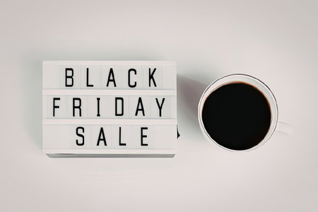 Black friday sale advertisement with coffee cup on white background