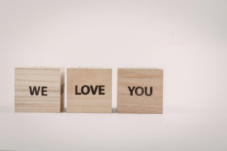 A heartwarming message of love and appreciation displayed on three wooden blocks