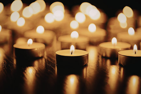 A warm and intimate arrangement of tea lights with soft, golden flames, creating a serene ambiance.