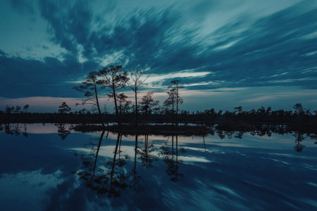 a peaceful lake scene at dusk with trees and clouds reflected in the calm water, creating a serene atmosphere