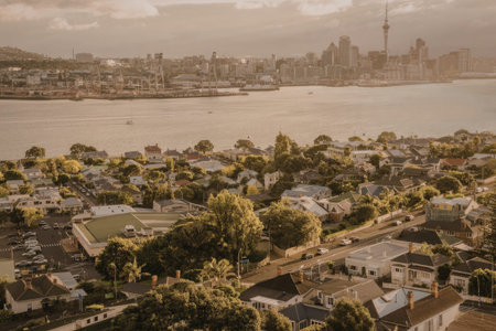 a pixelated image of a town by a body of water with trees and buildings