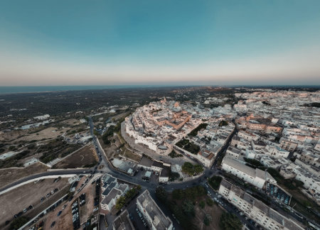 an aerial view of a small town near the sea with buildings and roads