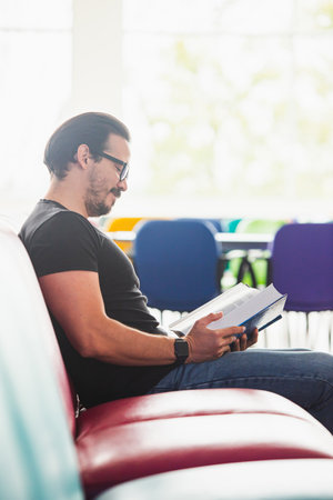 Man reading on sofaの写真素材
