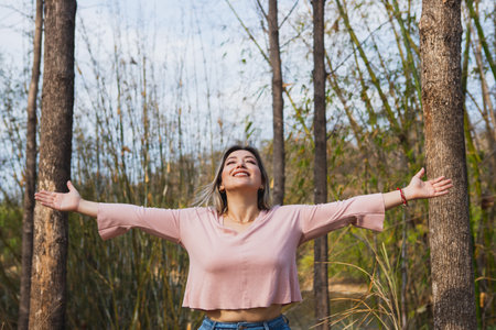 happy young woman in the forestの写真素材