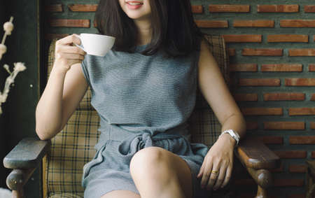 Coffee. Girl Drinking Coffee in Cafe