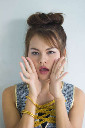 Beautiful young  model applying lipstick