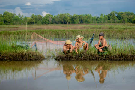 three boy play in natureの写真素材