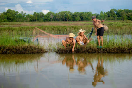 three boy play in natureの写真素材