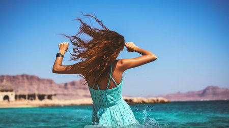 Seascape Serenity - Young brunette jumping out of turquoise water of Seaの素材