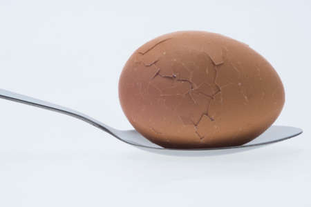 boiled egg with spoonの写真素材