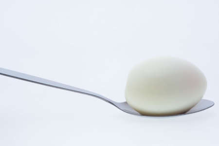 boiled egg with spoonの写真素材
