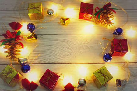 Christmas themed wallpaper with wooden table background.の写真素材