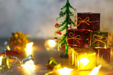 Christmas themed wallpaper with wooden table background.の写真素材