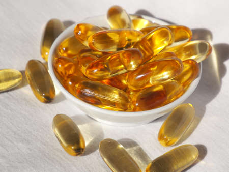 Omega-3 cod liver oil in a white container and with a white background picture.