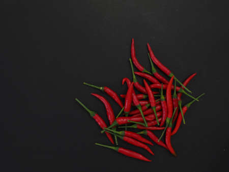 chili peppers on a black backgroundの写真素材