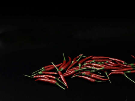 chili peppers on a black backgroundの写真素材