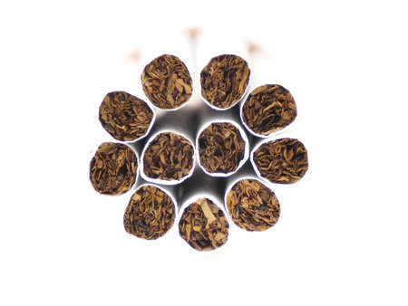 Close up of a cigarettes and the tobacco leaf that is in the cigarettesの写真素材