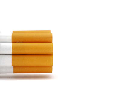 Close up of a cigarettes and the tobacco leaf that is in the cigarettesの写真素材