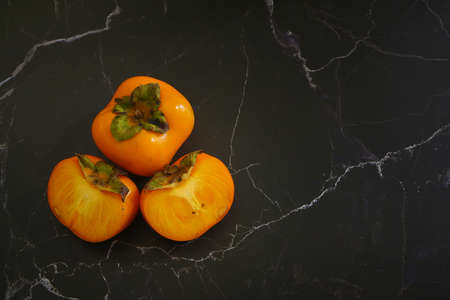 fresh ripe Persimmon or Chinese date plum persimmon photoの写真素材
