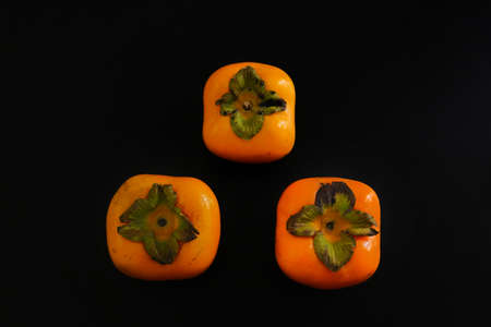 fresh ripe Persimmon or Chinese date plum persimmon photoの写真素材